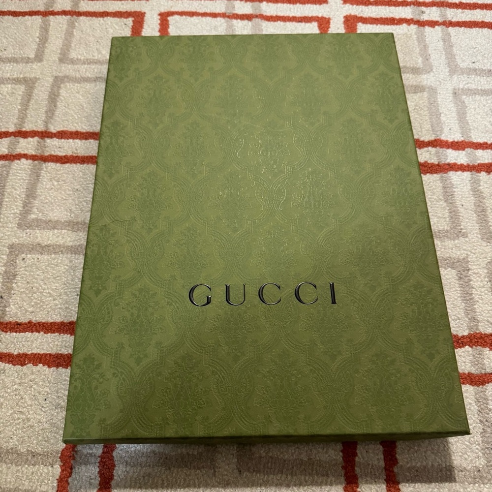 Gucci gift box, with matching tissue paper inside.